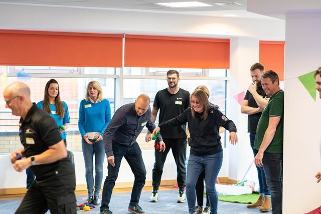 A group of adults taking a part in an activity facilitated by Boing