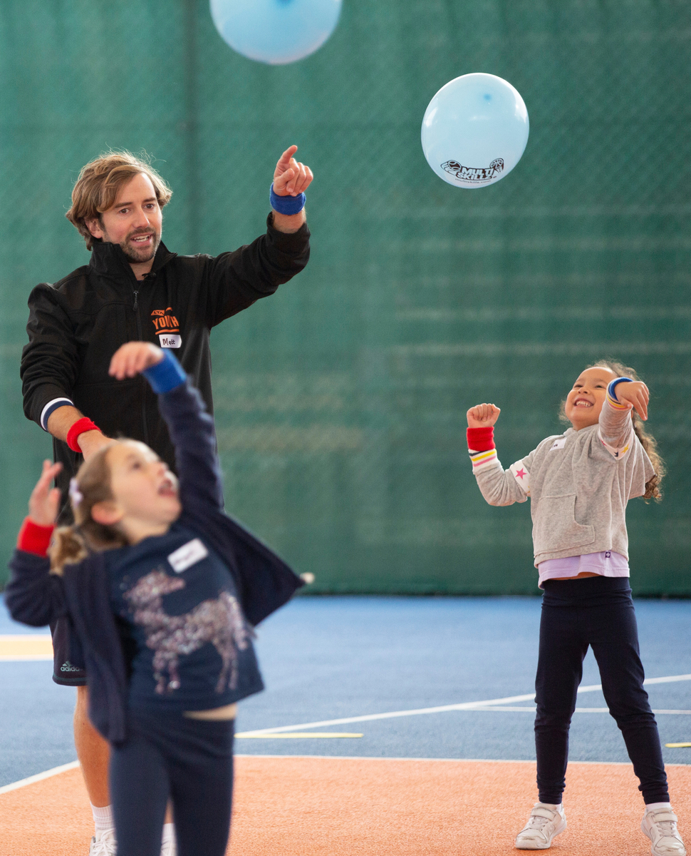 Tennis coach Matt with balloons