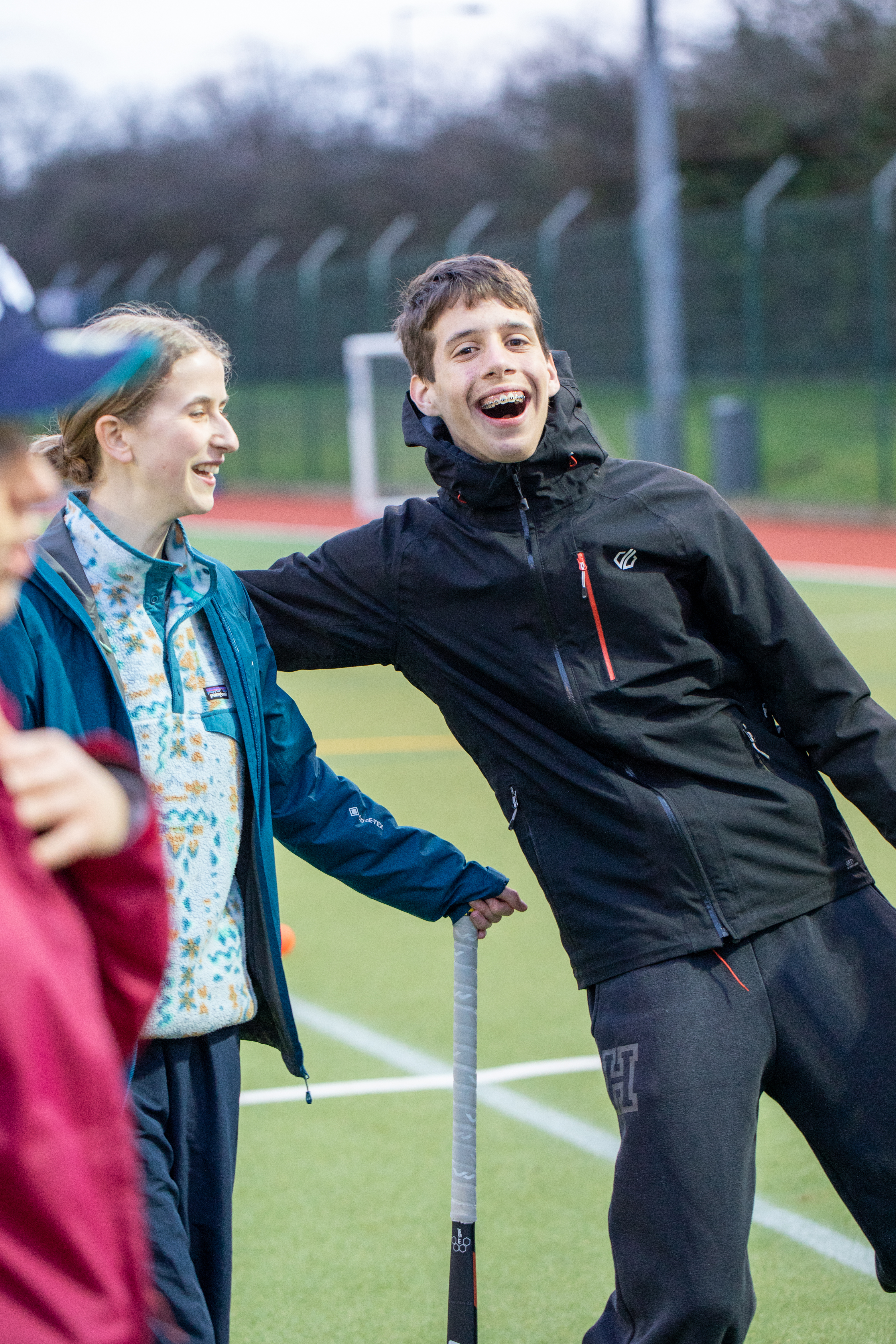 coaching children with mixed abilities - a young person laughs with their coach - Bristol Flyerz