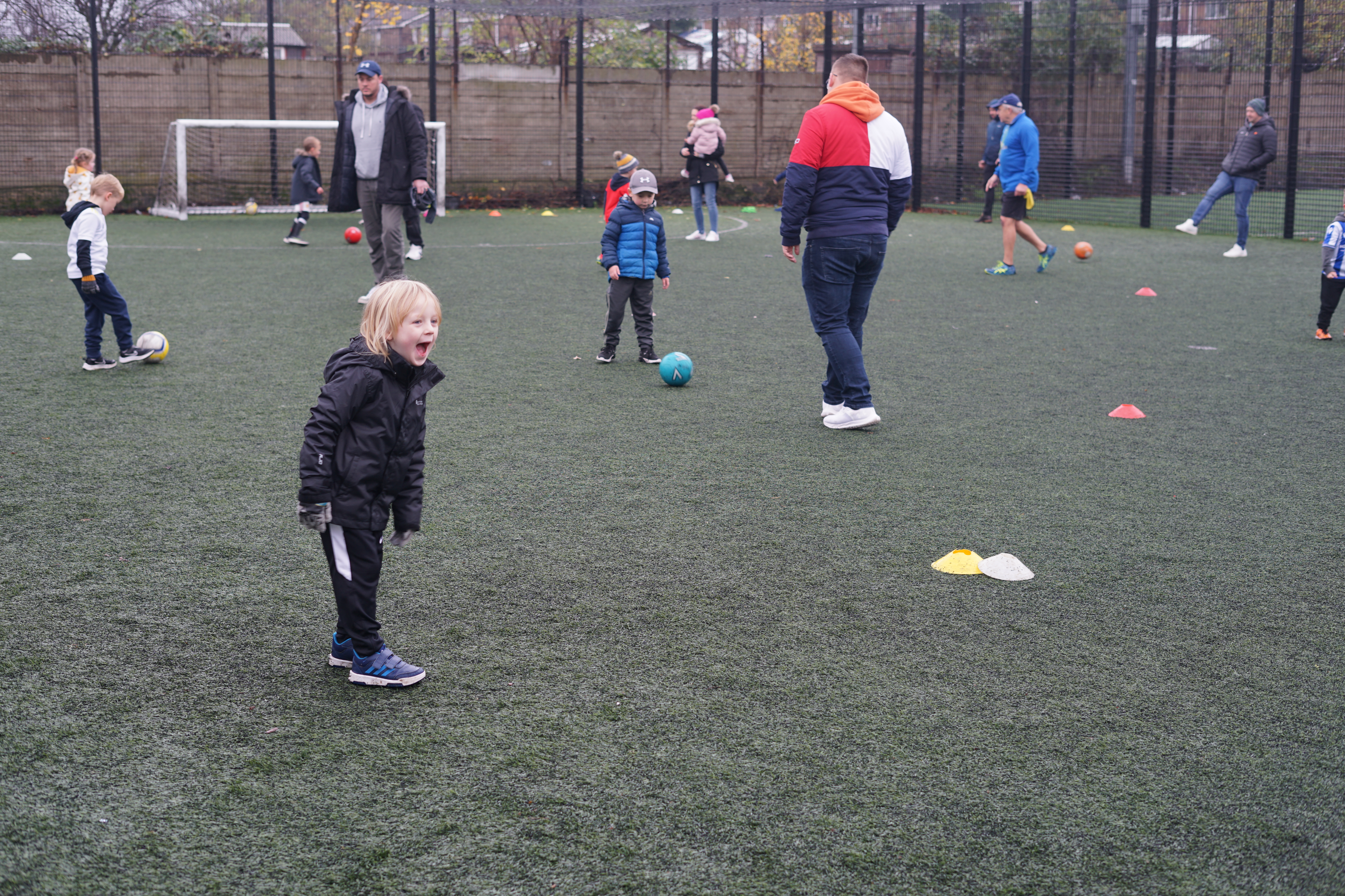 Child at Tot's Coaching enjoying playing football