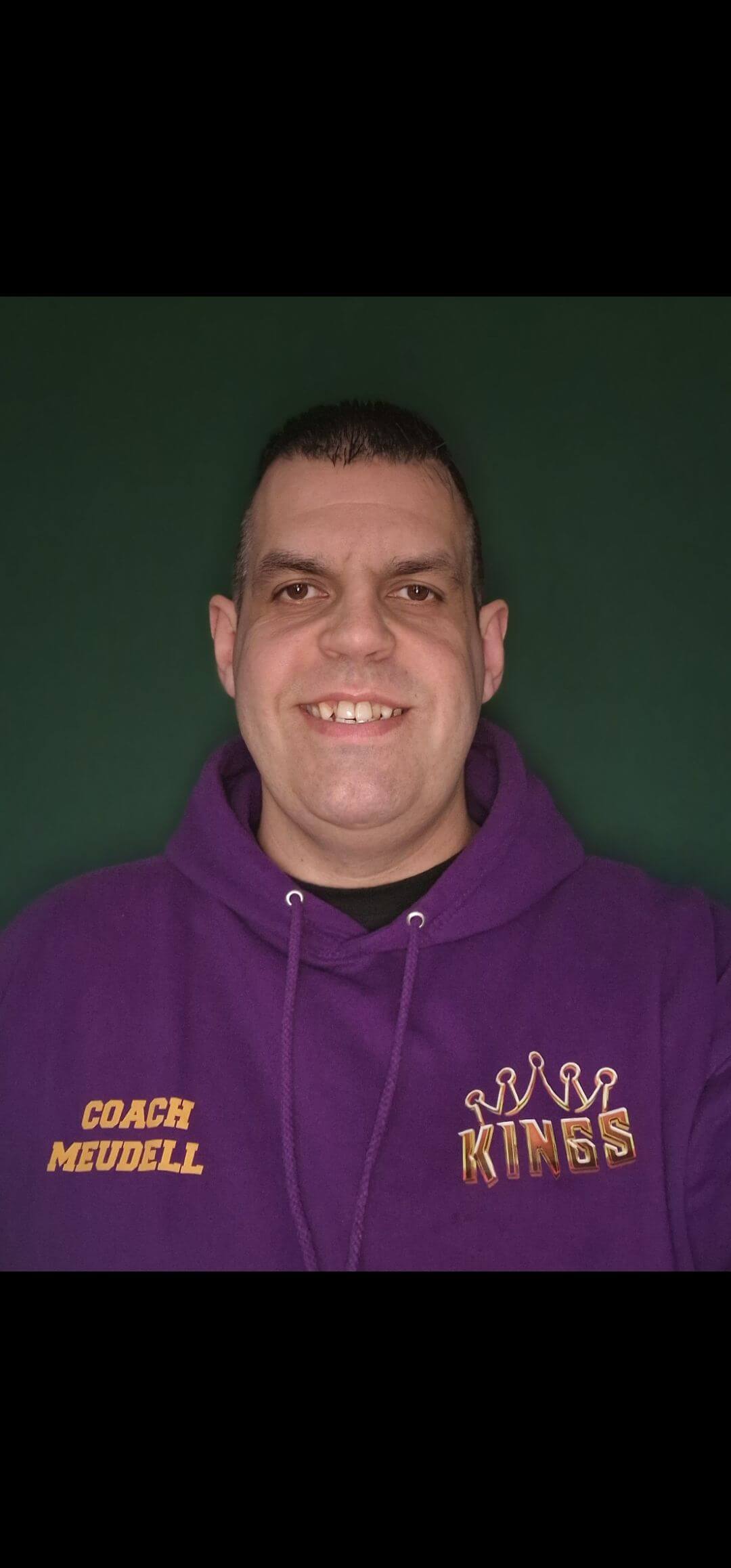 A headshot of Andy who is an American Football Coach