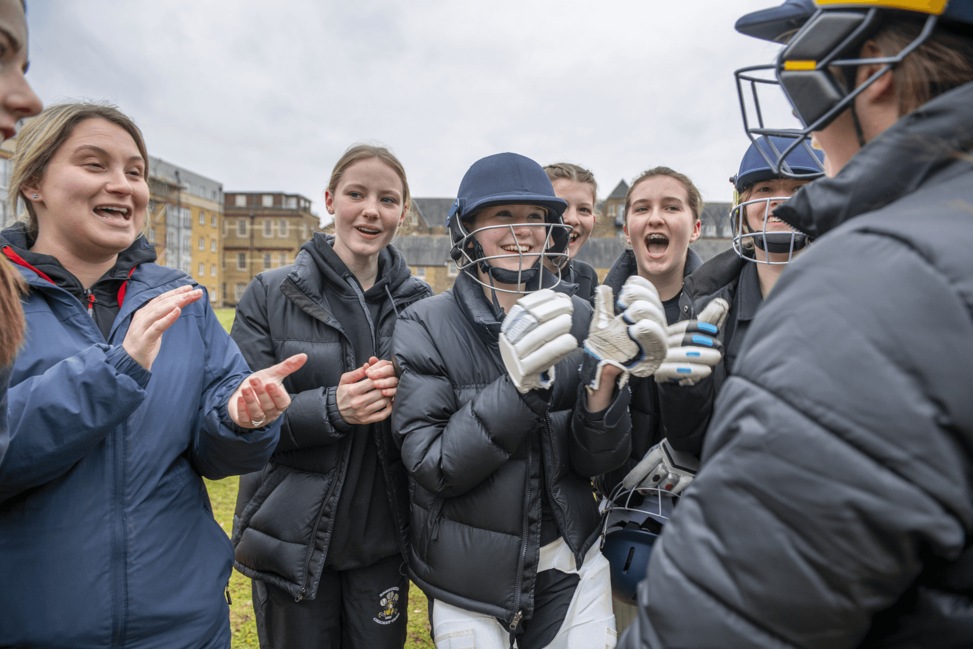 Cara and the cricket team clapping