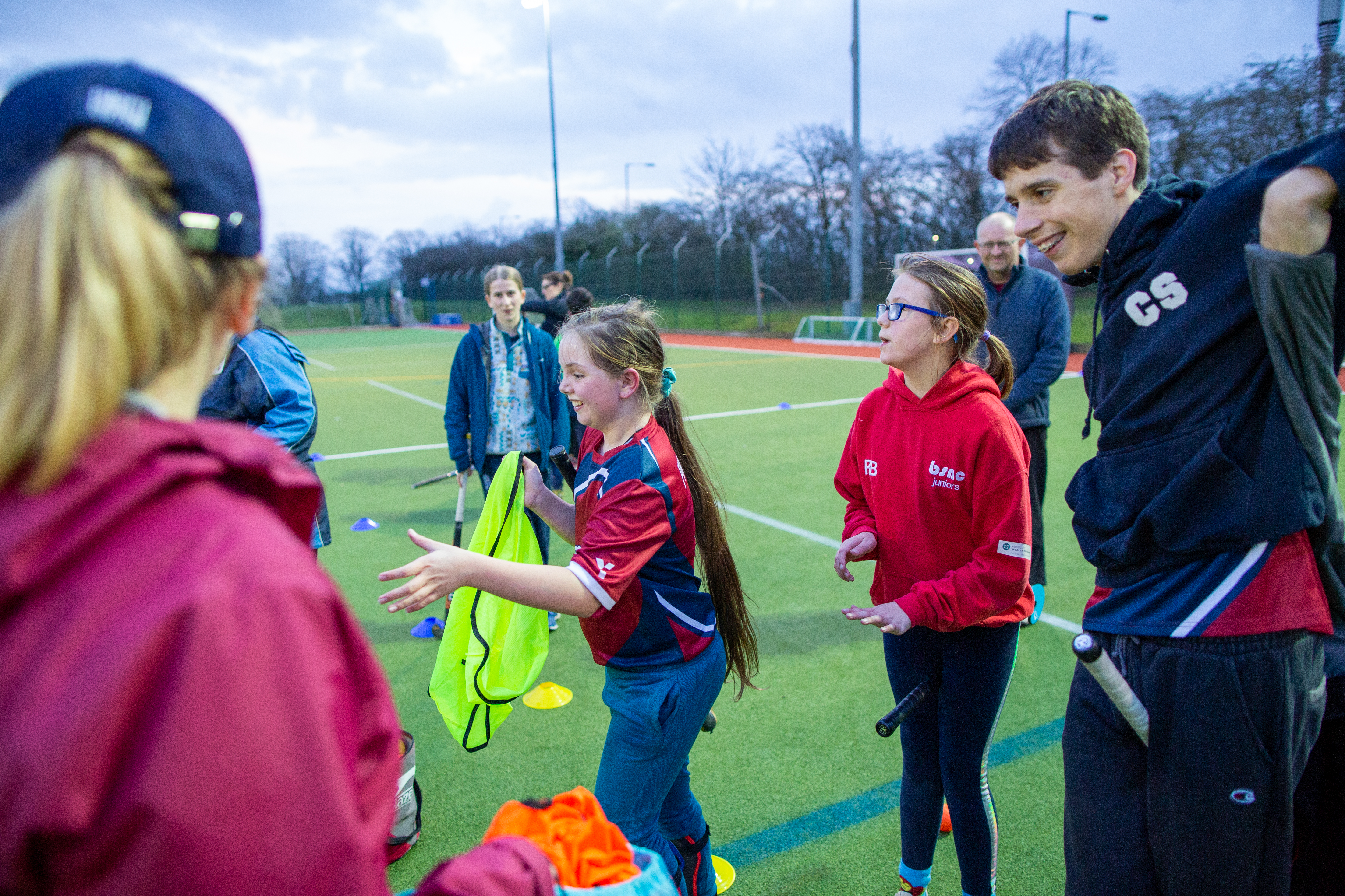 coaching children with mixed abilities - a group of young people of mixed abilities playing hockey