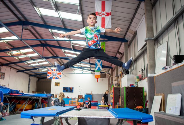 How to coach trampolining to kids - boy mid jump on trampoline