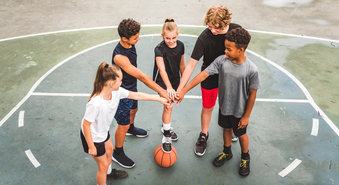 Group of teenagers team talk before playing basketball
