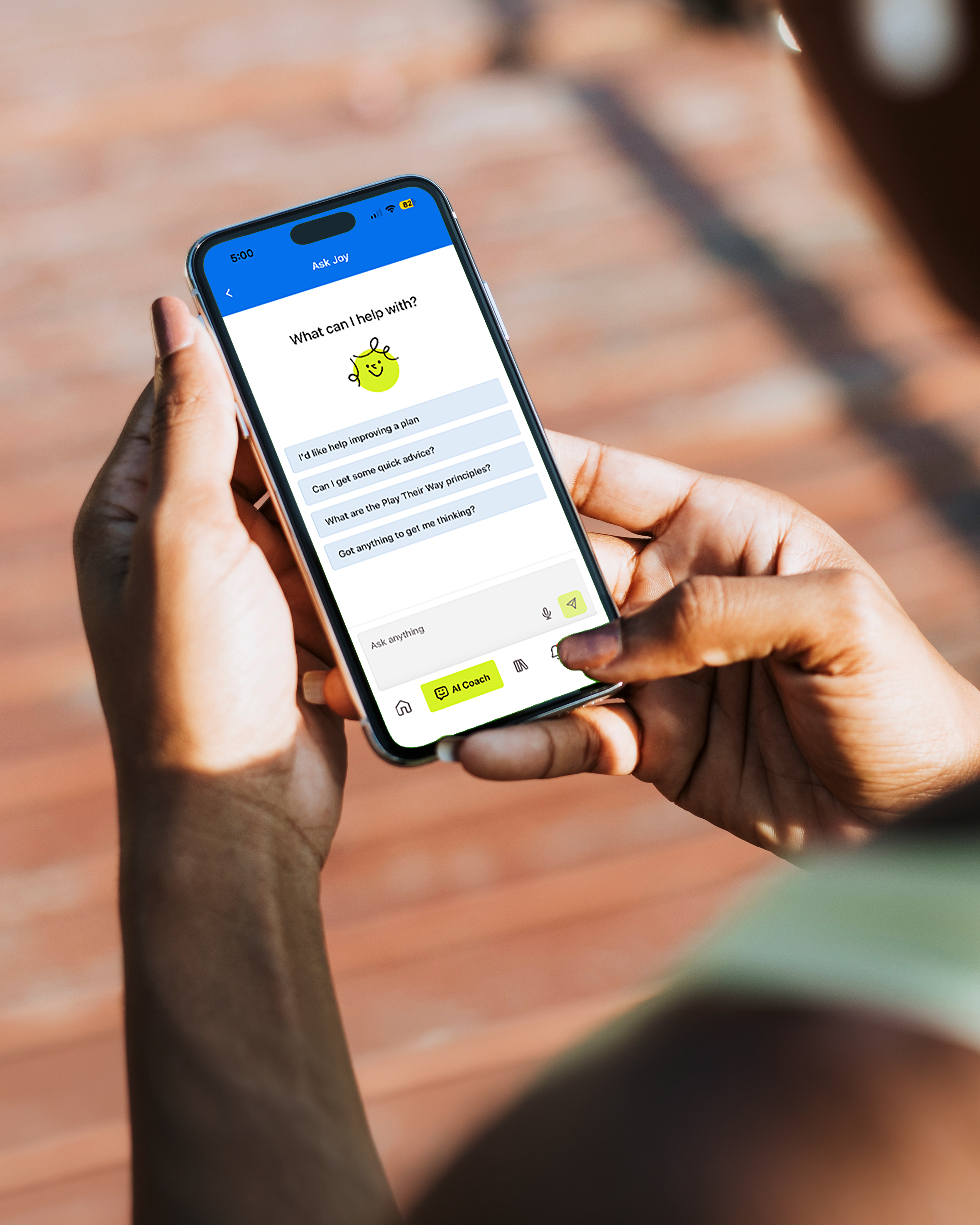 An image of a phone screen, with someone accessing Joy, the AI assistant on the Play Their Way App.